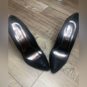Black heels , worn once .